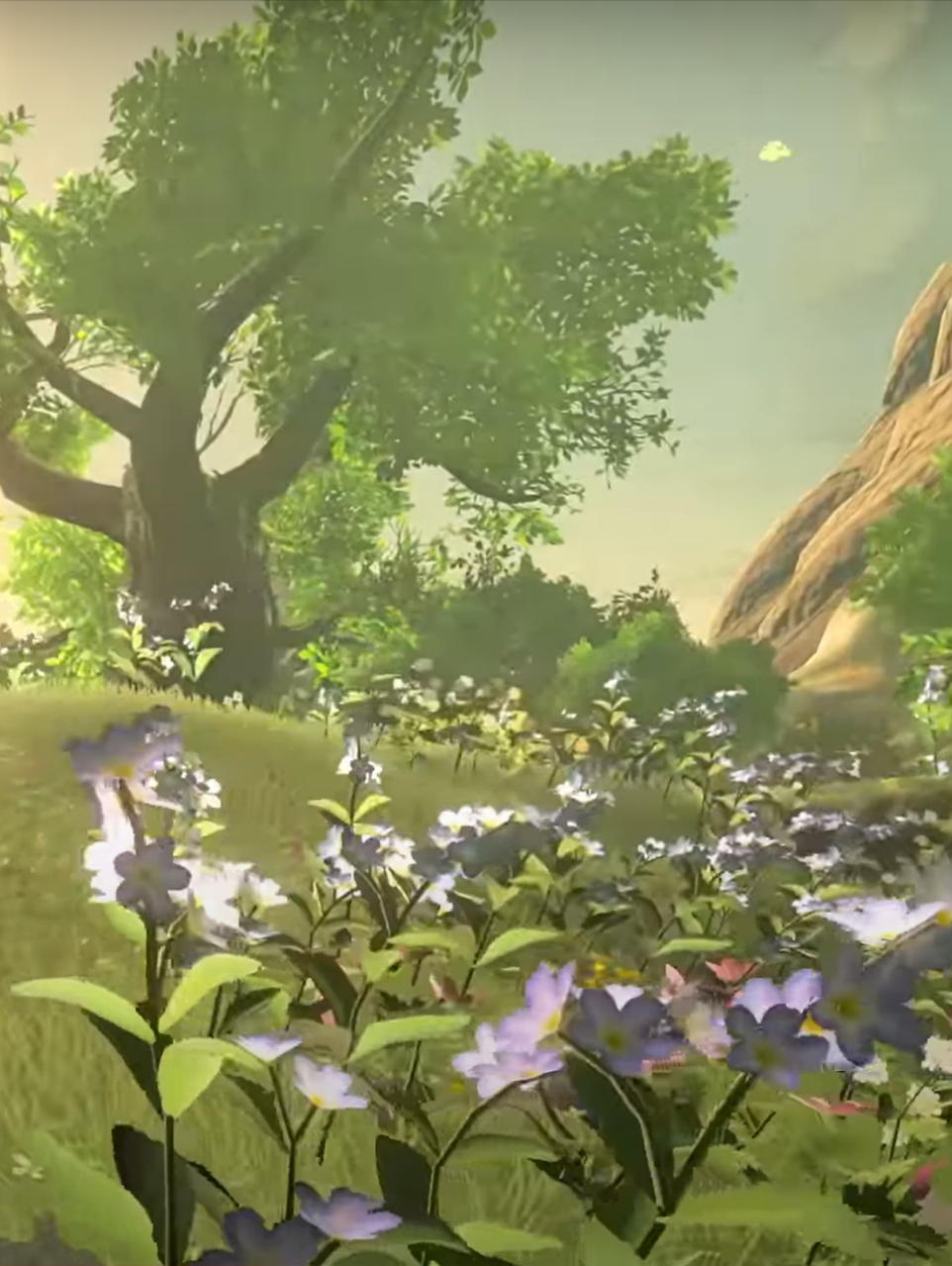 plains of hyrule with large tree in the background and purple flowers in the forground